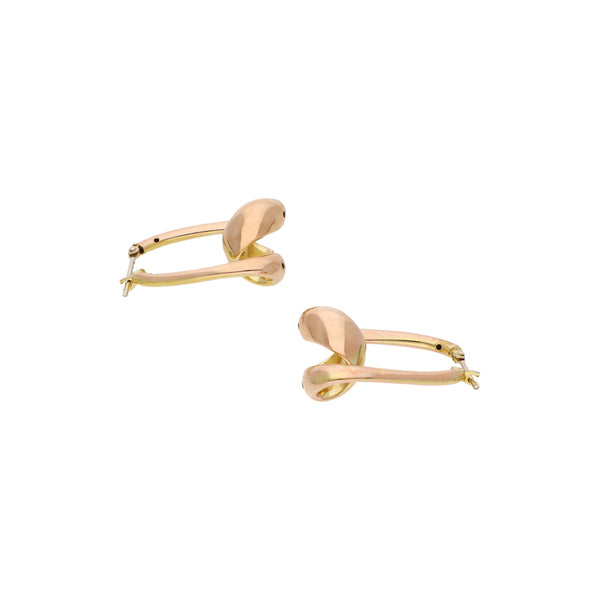 Arracadas estilizadas en oro rosa 14 kilates.