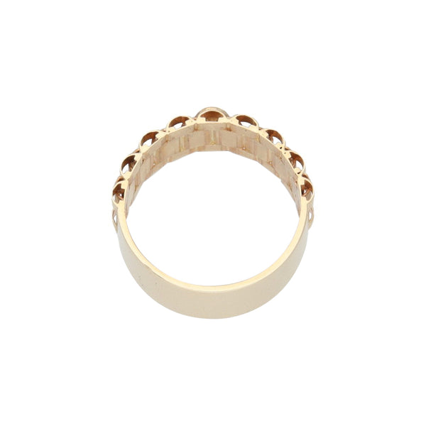 Anillo diseño especial con aplicación motivo corona en oro amarillo 14 kilates.