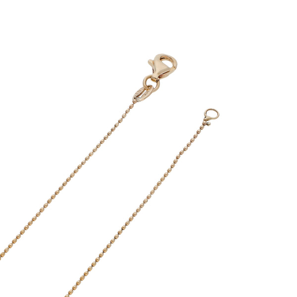 Gargantilla eslabón boleado con aplicaciones en oro tres tonos 14 kilates.