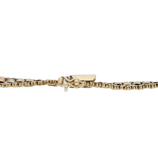 Pulsera eslabón boleado en oro tres tonos 14 kilates.