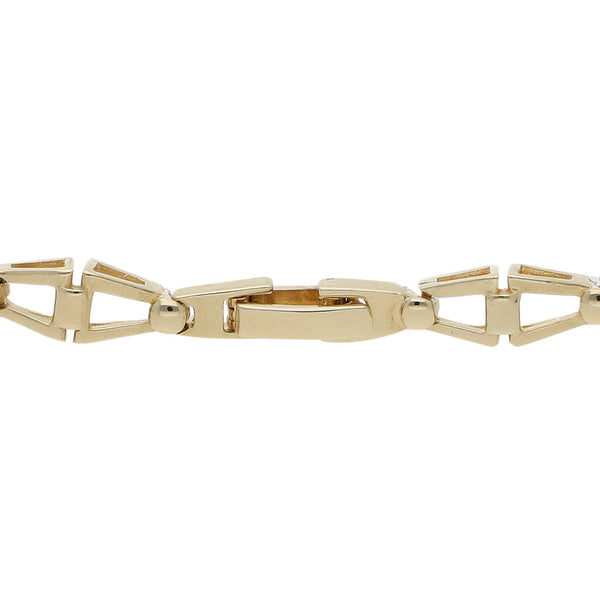 Pulsera eslabón articulado con circonias en oro dos tonos 14 kilates.