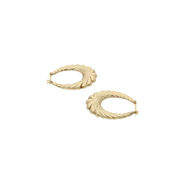 Arracadas huecas en oro amarillo 14 kilates.