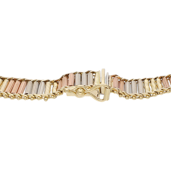 Pulsera eslabón boleado en oro tres tonos 14 kilates.