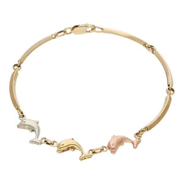 Pulsera eslabón articulado con aplicaciones motivo delfines en oro tres tonos 14 kilates.