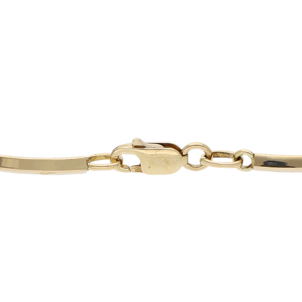 Pulsera eslabón articulado con aplicaciones motivo delfines en oro tres tonos 14 kilates.
