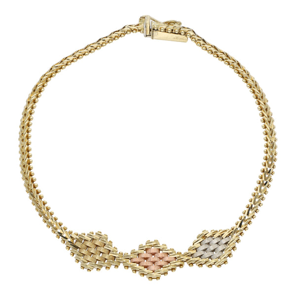 Pulsera eslabón boleado con aplicaciones en oro tres tonos 14 kilates.