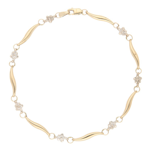 Pulsera eslabón combinado motivo flor en oro amarillo 14 kilates.