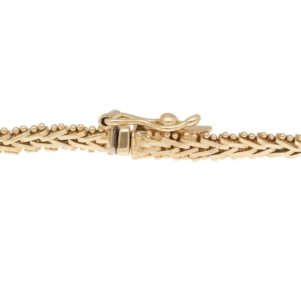 Pulsera eslabón boleado con aplicación en oro tres tonos 14 kilates.