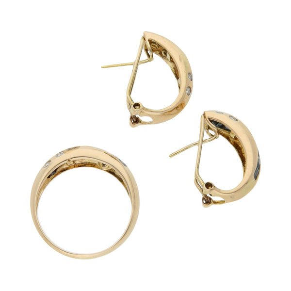 Juego de anillo y aretes estilizados con diamantes y zafiros en oro amarillo 14 kilates.
