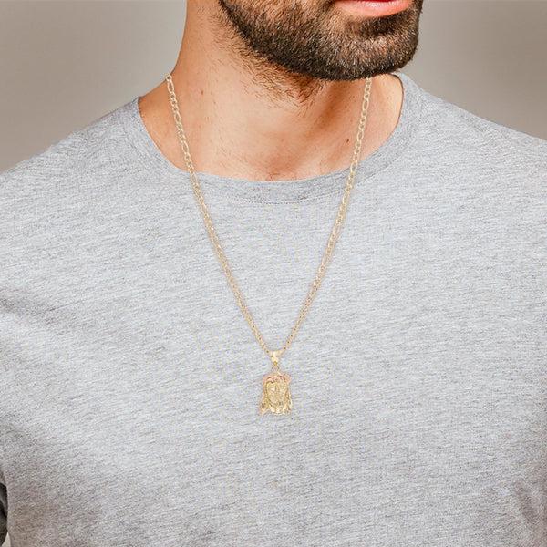 Collar de tres eslabones por uno y medalla motivo Divino Rostro en oro dos tonos 14 kilates.
