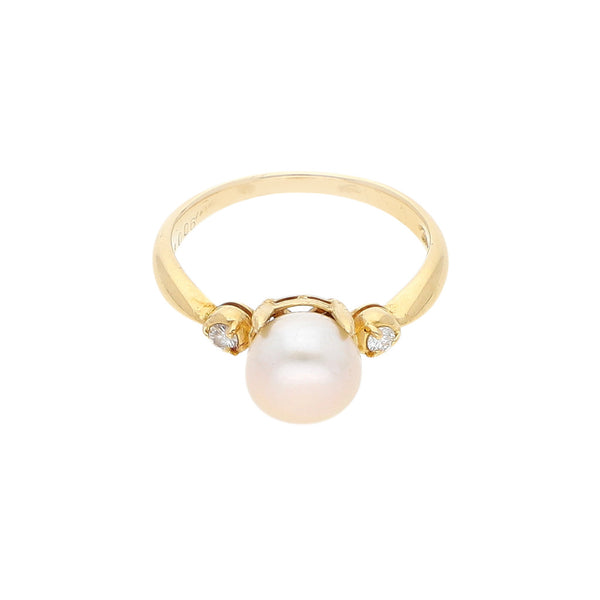 Anillo diseño especial con diamantes y perla en oro amarillo 18 kilates.