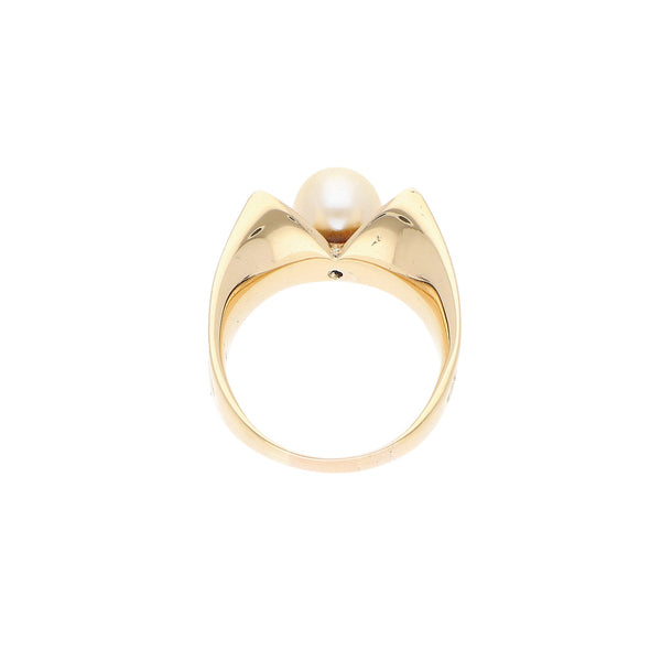 Anillo diseño especial con perla en oro amarillo 14 kilates.