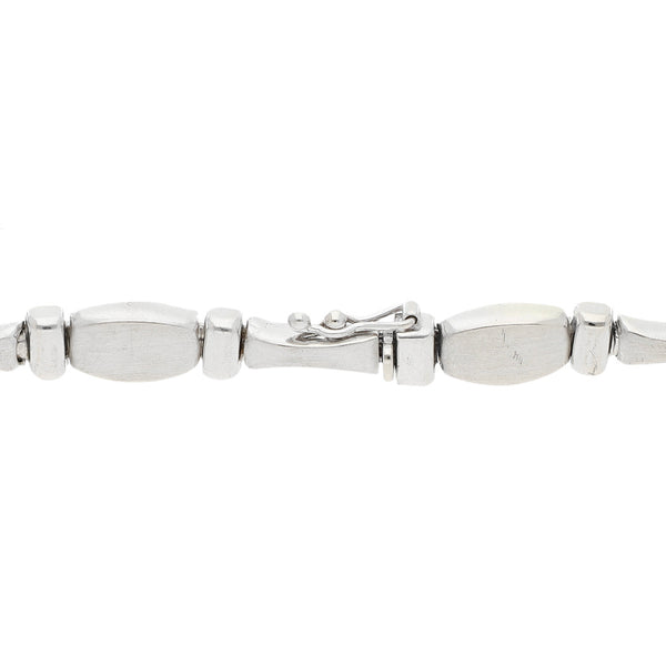 Pulsera eslabón articulado en oro blanco 14 kilates.