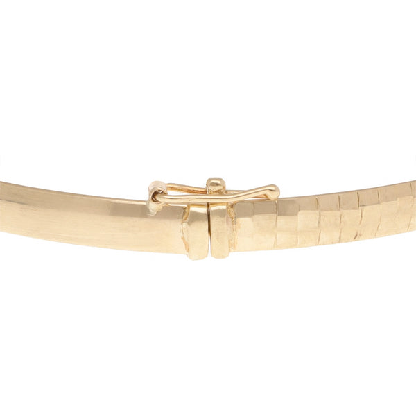 Pulsera de arillo articulada en oro amarillo 14 kilates.