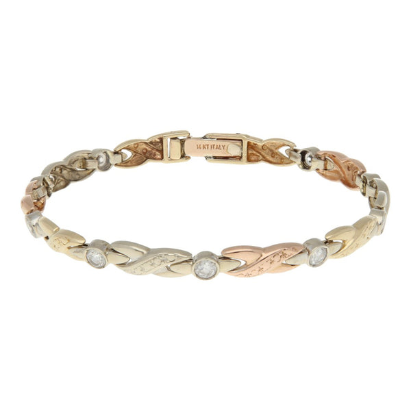 Pulsera eslabón articulado con circonias en oro tres tonos 14 kilates.