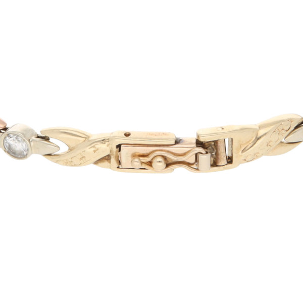 Pulsera eslabón articulado con circonias en oro tres tonos 14 kilates.