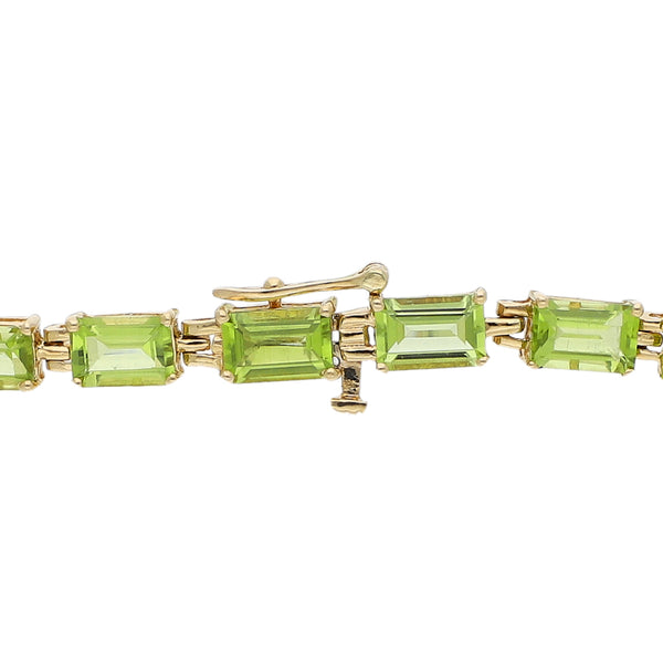 Juego de anillo, pulsera y dije diseño especial con diamantes y sintéticos en oro amarillo 14 kilates.