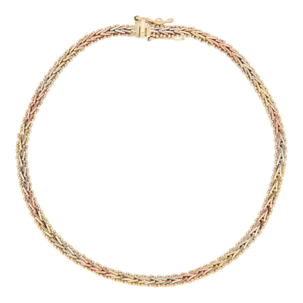 Pulsera eslabón boleado en oro tres tonos 12 kilates.