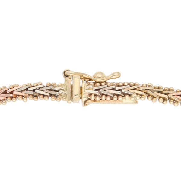 Pulsera eslabón boleado en oro tres tonos 12 kilates.