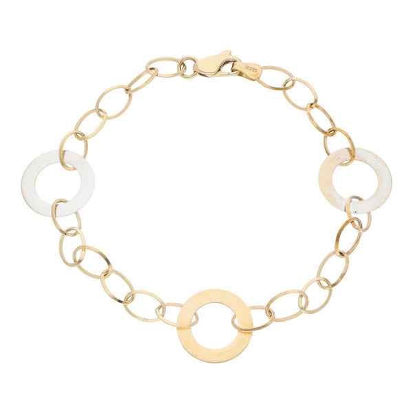 Pulsera eslabón cruzado con aplicaciones motivo aros en oro dos tonos 14 kilates.