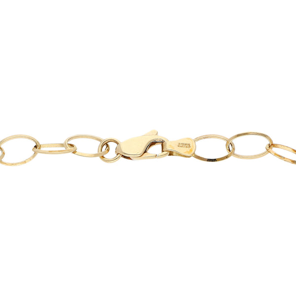 Pulsera eslabón cruzado con aplicaciones motivo aros en oro dos tonos 14 kilates.