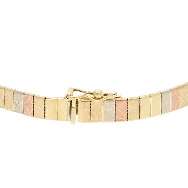 Pulsera eslabón planchado en oro tres tonos 14 kilates.