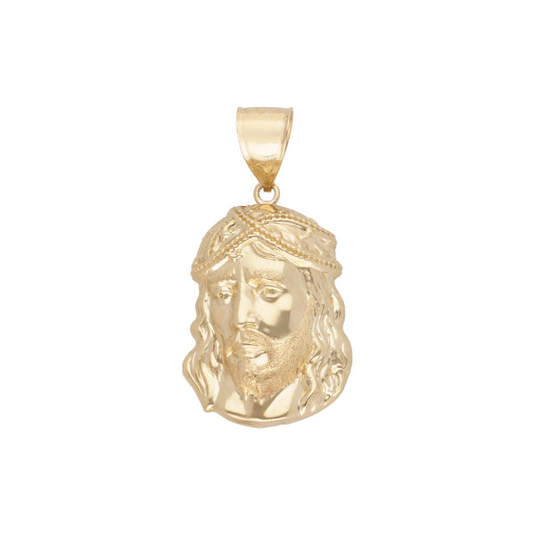 Medalla laminada motivo Divino Rostro en oro amarillo 14 kilates.