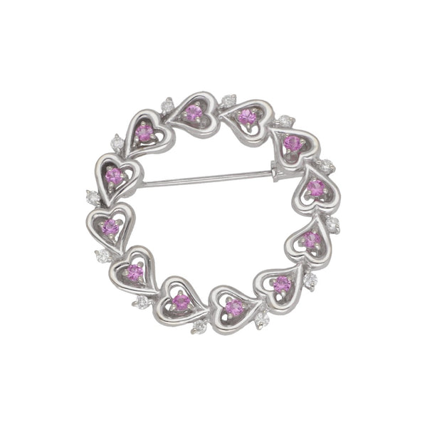 Prendedor diseño especial motivo corazones en diamantes y rubies en oro blanco 18 kilates.