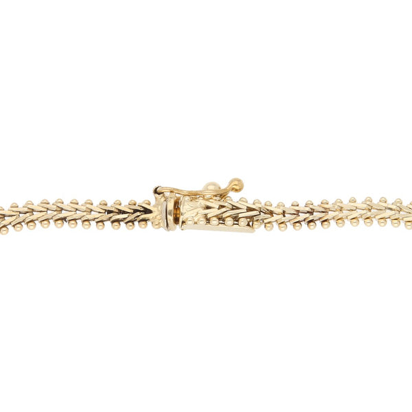 Pulsera eslabón boleado en oro tres tonos 14 kilates.