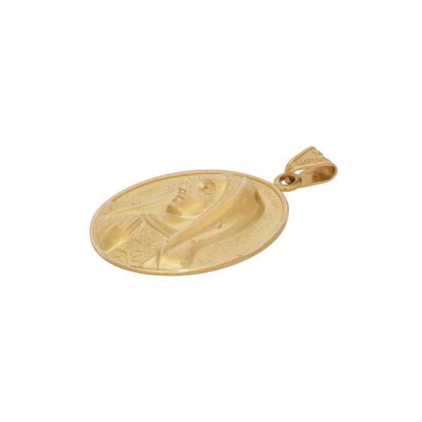 Medalla hueca motivo Virgen de Guadalupe en oro amarillo 18 kilates.