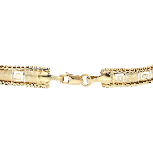 Pulsera eslabón boleado calado motivo grecas en oro amarillo 14 kilates.