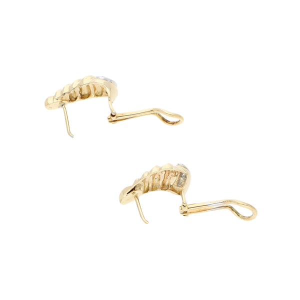 Juego de anillo y aretes estilizados con diamantes en oro dos tonos 14 kilates.