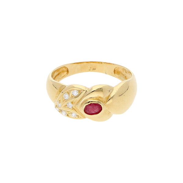 Anillo diseño especial con rubí y circonias en oro amarillo 18 kilates.