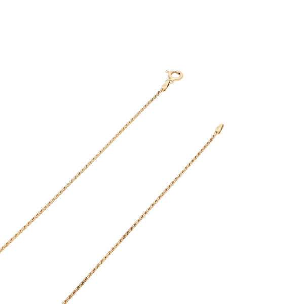 Collar eslabón torzal y dije hueco motivo delfín en oro amarillo 14 kilates.