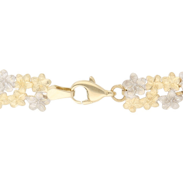 Pulsera eslabón articulado motivo flores en oro dos tonos 14 kilates.