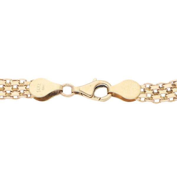 Pulsera eslabón laminado en oro dos tonos 14 kilates.