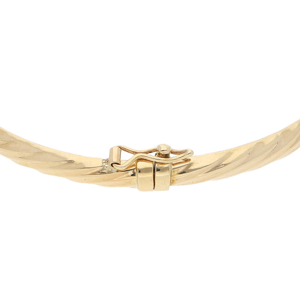Pulsera de arillo articulada en oro amarillo 14 kilates.
