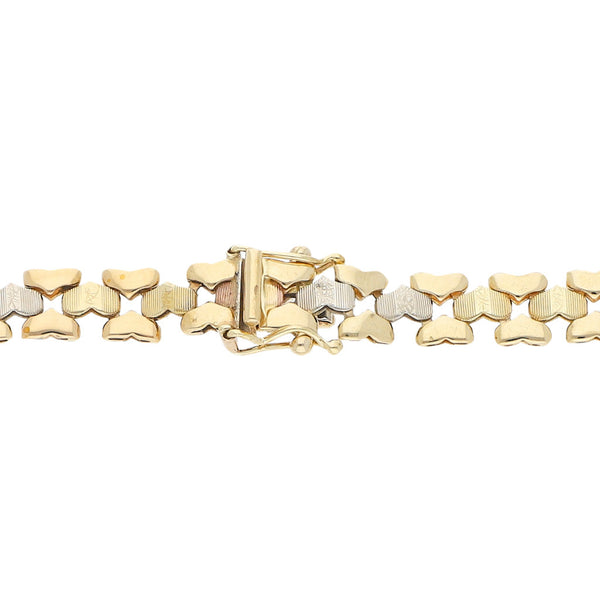Pulsera eslabón articulado en oro tres tonos 14 kilates.