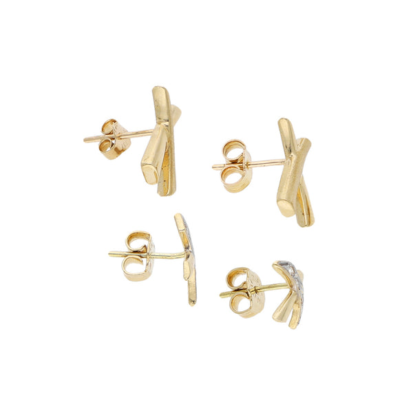 Dos broqueles diseño especial con circonias en oro amarillo 14 kilates.