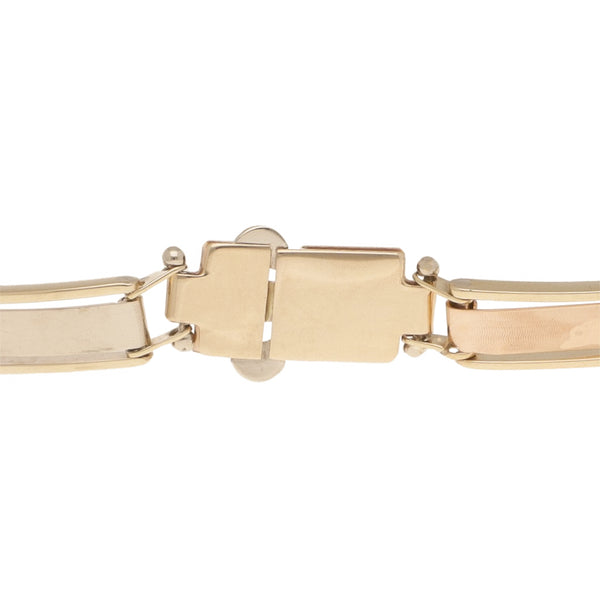 Pulsera eslabón laminado motivo delfines en oro tres tonos 14 kilates.