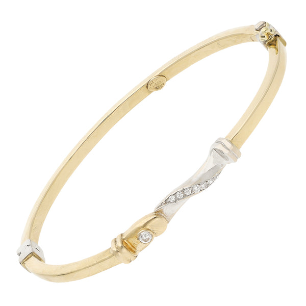 Pulsera de arillo articulada con circonias en oro dos tonos 14 kilates.