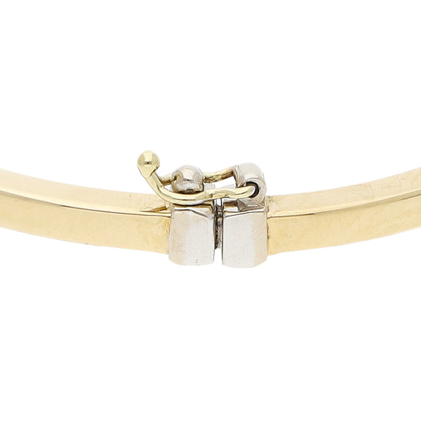 Pulsera de arillo articulada con circonias en oro dos tonos 14 kilates.