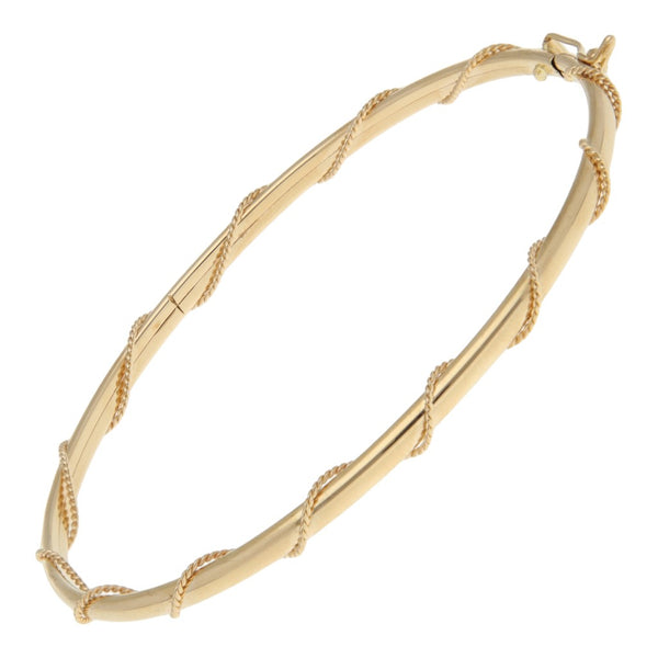 Pulsera de arillo lisa con aplicación en oro amarillo 14 kilate.