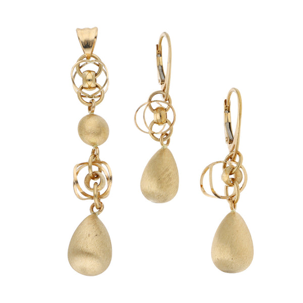 Juego de dije y aretes diseño especial en oro amarillo 14 kilates.
