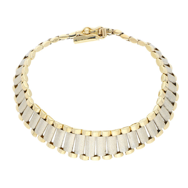 Pulsera eslabón articulado en oro dos tonos 14 kilates.