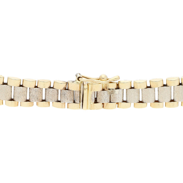 Pulsera eslabón articulado en oro dos tonos 14 kilates.