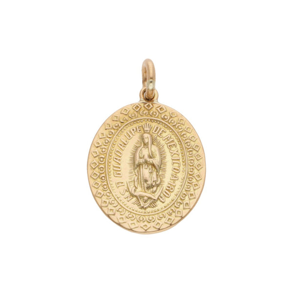 Medalla labrada motivo Virgen de Guadalupe en oro amarillo 14 kilates.