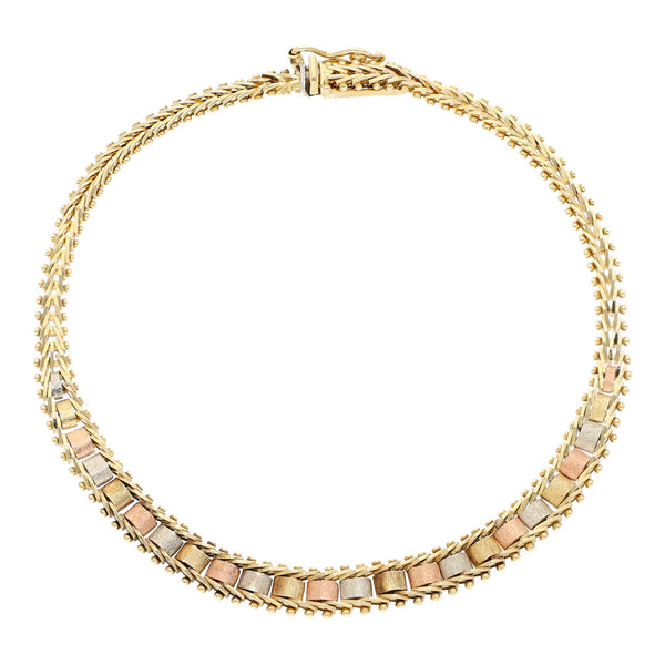 Pulsera eslabón boleado en oro tres tonos 14 kilates.