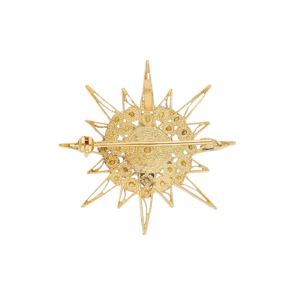 Prendedor diseño especial motivo estrella en oro amarillo 18 kilates.