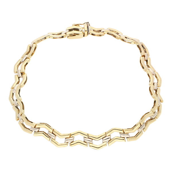 Pulsera eslabón articulado en oro dos tonos 14 kilates.